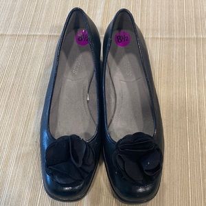 Black Pom Pom slip ons.